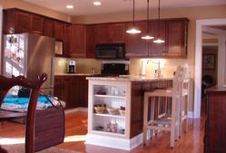 Modern kitchen interior renovation with cherry wood cabinets